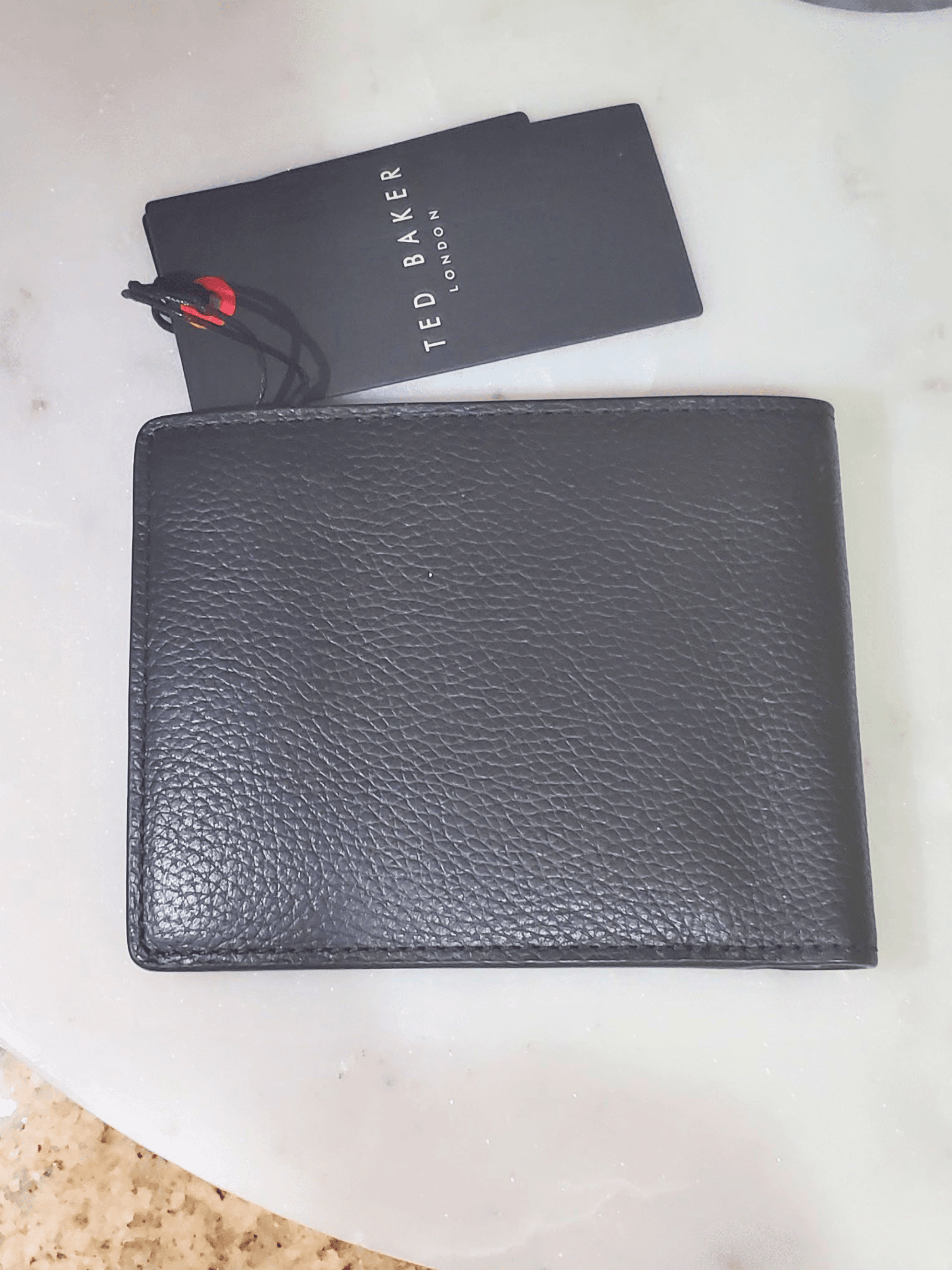 Ted Baker , Front. Condition: Mint.
